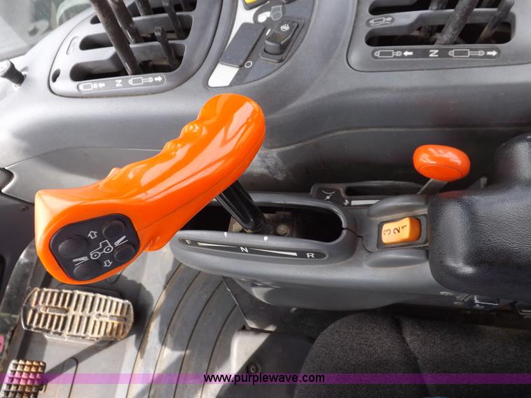 image for item H9107 1999 New Holland TV140 bi-directional MFWD tractor