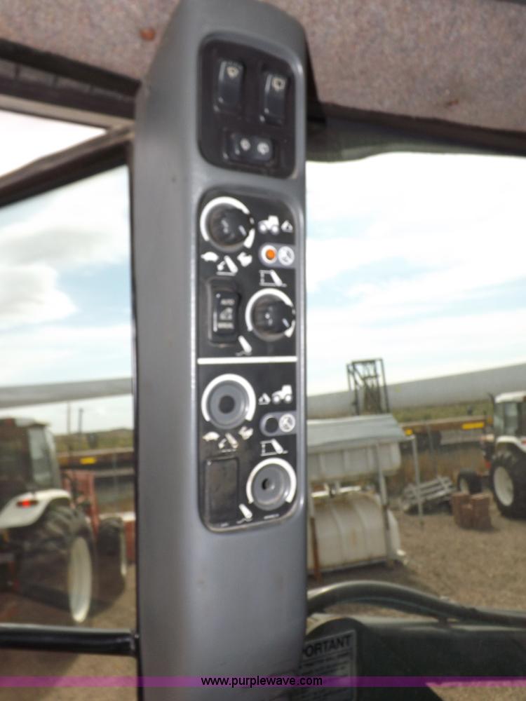 image for item H9107 1999 New Holland TV140 bi-directional MFWD tractor