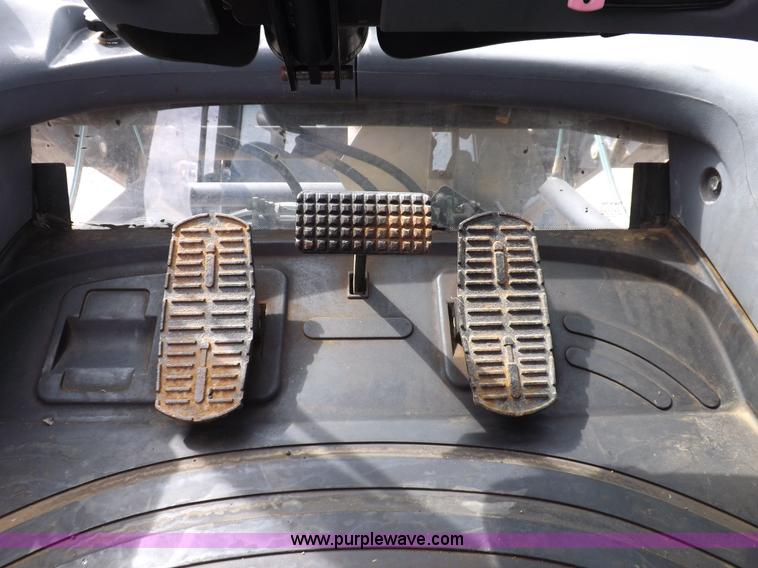 image for item H9107 1999 New Holland TV140 bi-directional MFWD tractor