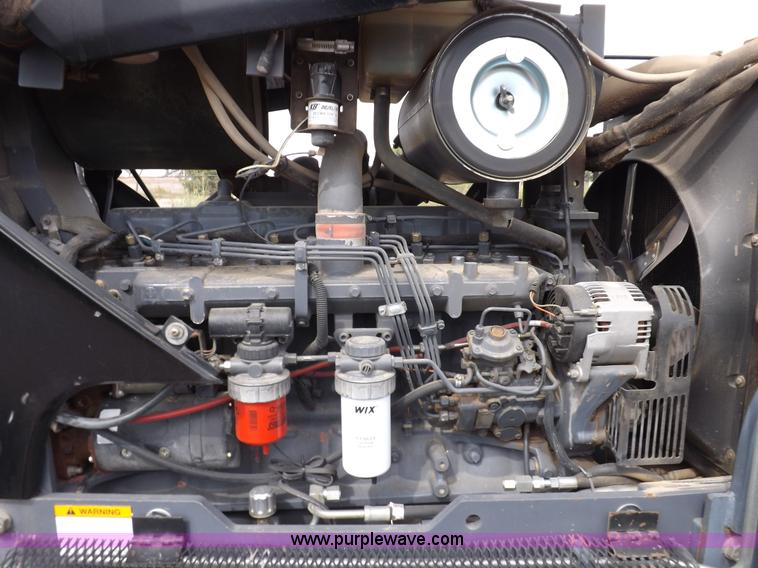 image for item H9107 1999 New Holland TV140 bi-directional MFWD tractor