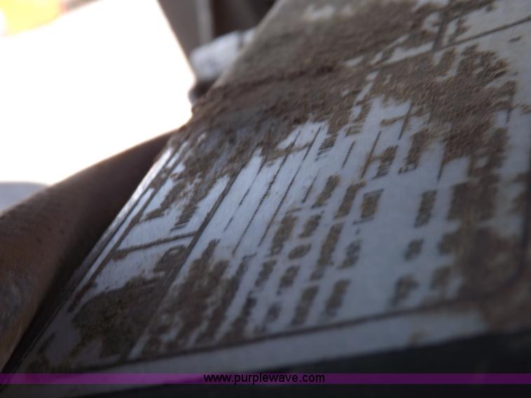 image for item H9107 1999 New Holland TV140 bi-directional MFWD tractor