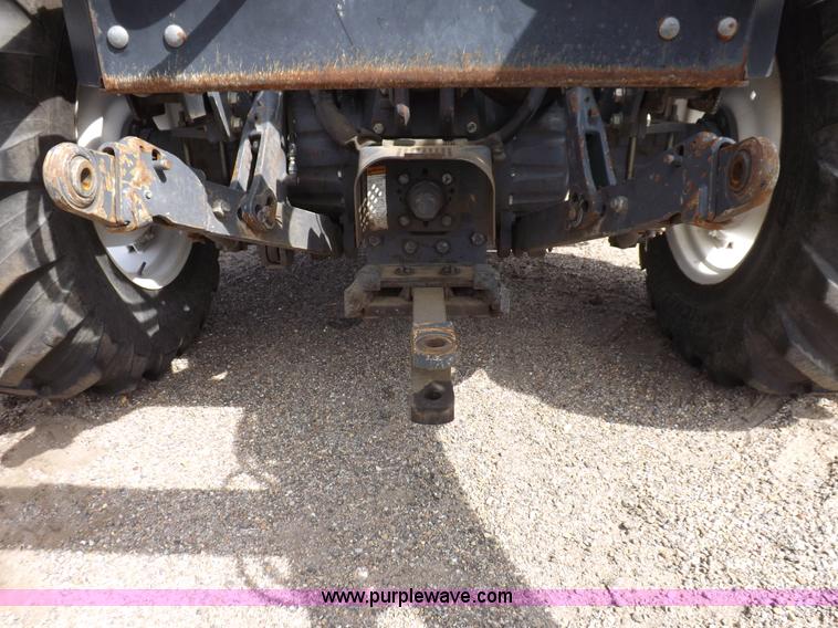 image for item H9107 1999 New Holland TV140 bi-directional MFWD tractor