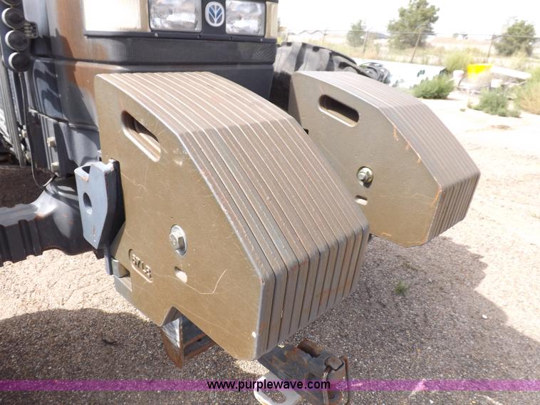 image for item H9107 1999 New Holland TV140 bi-directional MFWD tractor