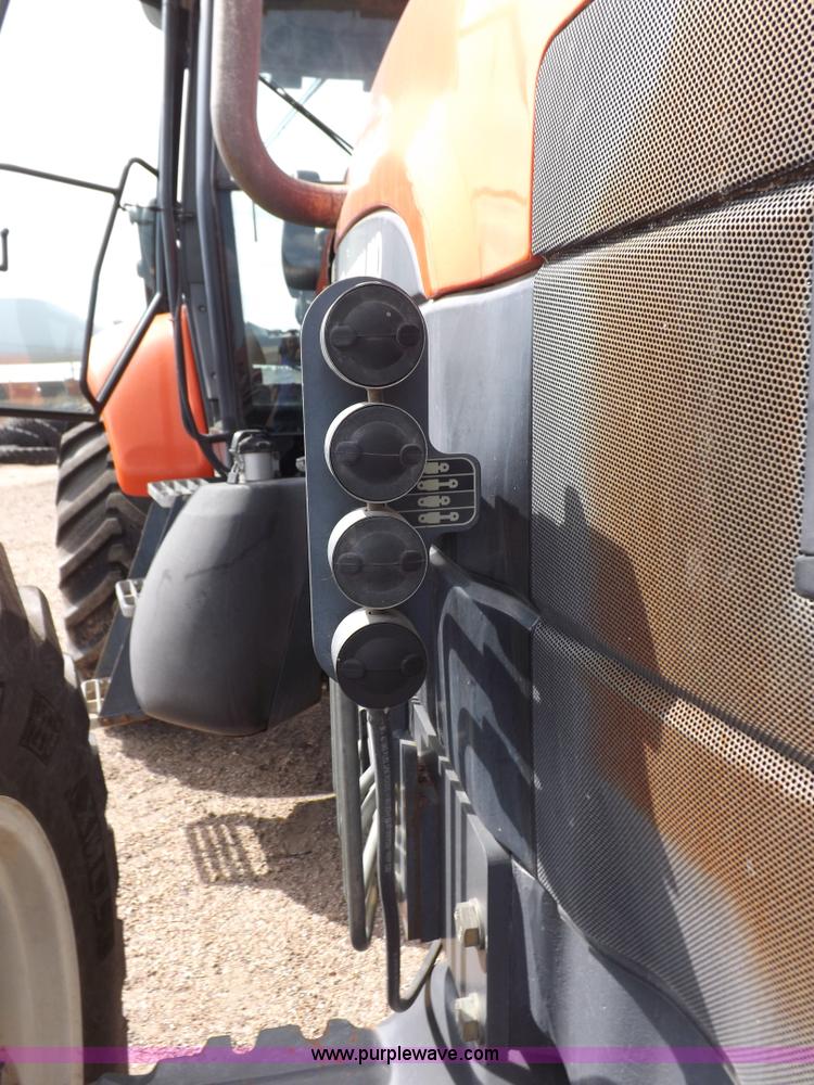 image for item H9107 1999 New Holland TV140 bi-directional MFWD tractor