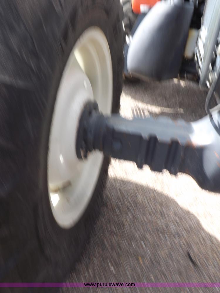 image for item H9107 1999 New Holland TV140 bi-directional MFWD tractor