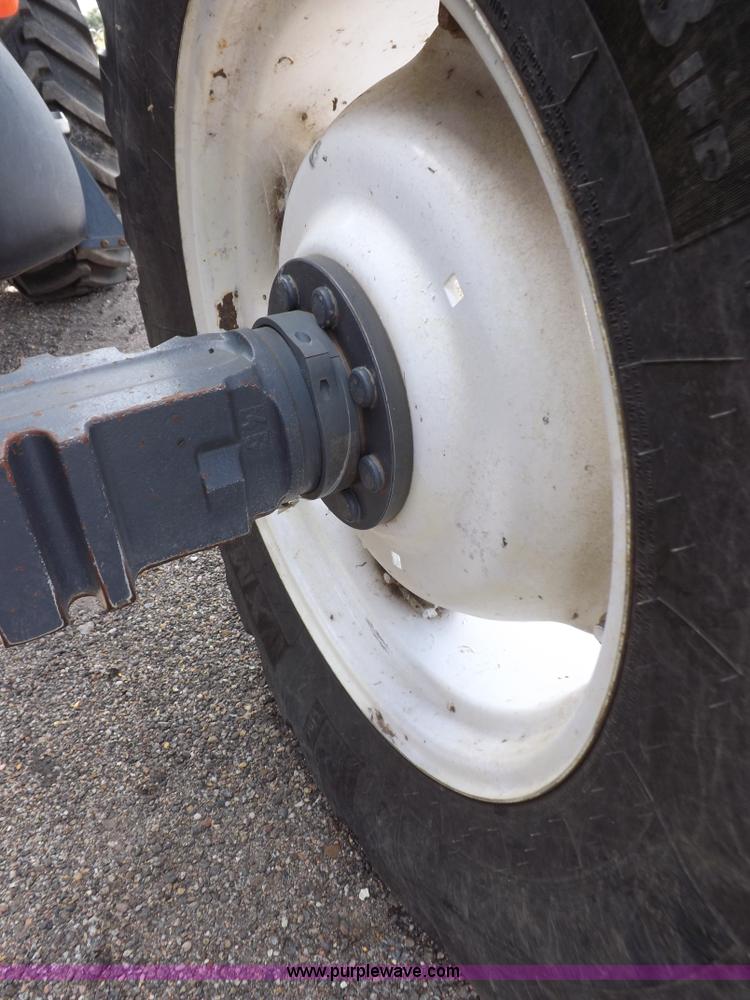 image for item H9107 1999 New Holland TV140 bi-directional MFWD tractor