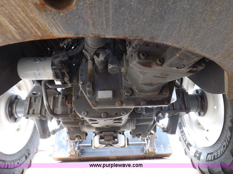 image for item H9107 1999 New Holland TV140 bi-directional MFWD tractor