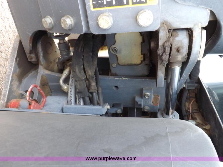 image for item H9107 1999 New Holland TV140 bi-directional MFWD tractor