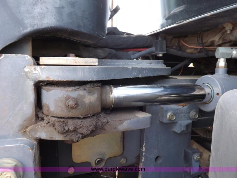 image for item H9107 1999 New Holland TV140 bi-directional MFWD tractor