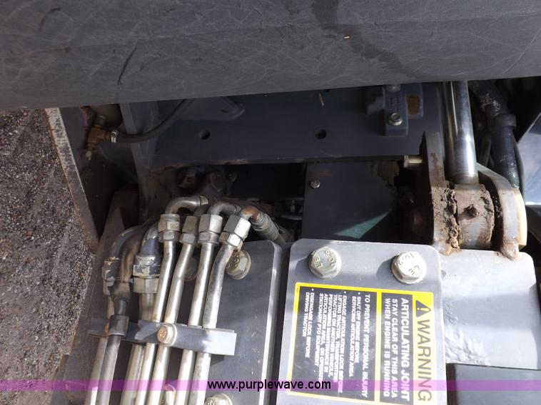 image for item H9107 1999 New Holland TV140 bi-directional MFWD tractor