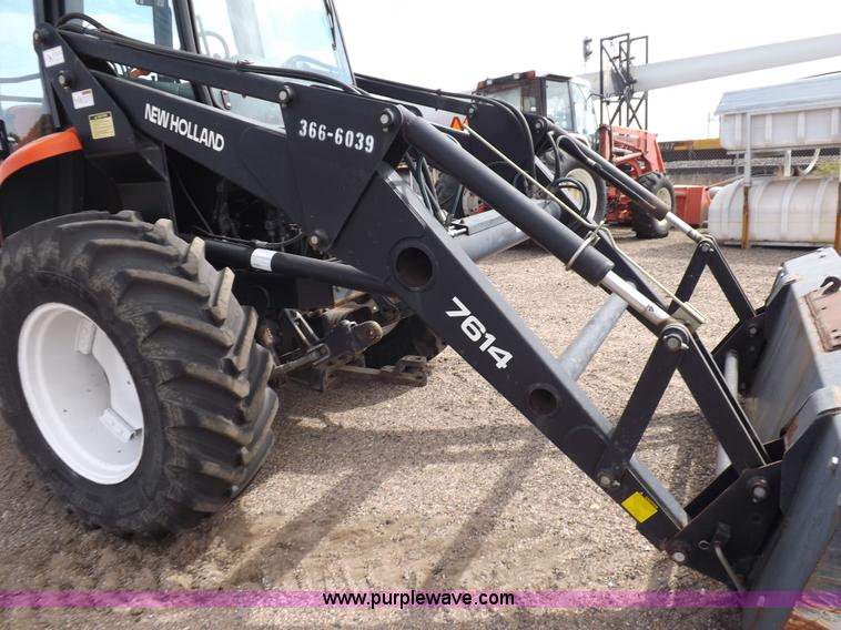 image for item H9107 1999 New Holland TV140 bi-directional MFWD tractor