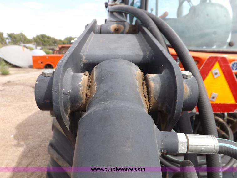 image for item H9107 1999 New Holland TV140 bi-directional MFWD tractor