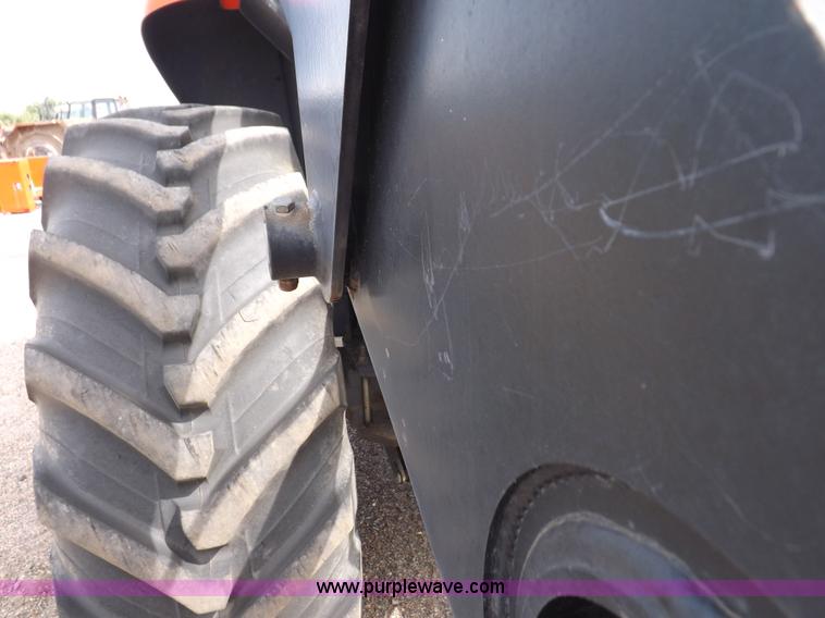 image for item H9107 1999 New Holland TV140 bi-directional MFWD tractor