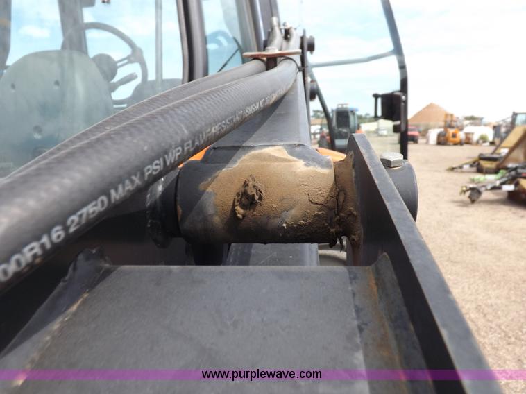 image for item H9107 1999 New Holland TV140 bi-directional MFWD tractor