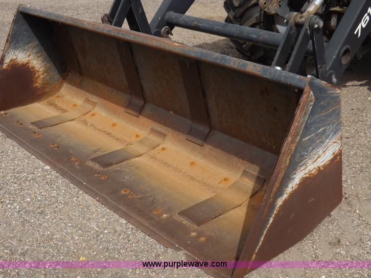 image for item H9107 1999 New Holland TV140 bi-directional MFWD tractor