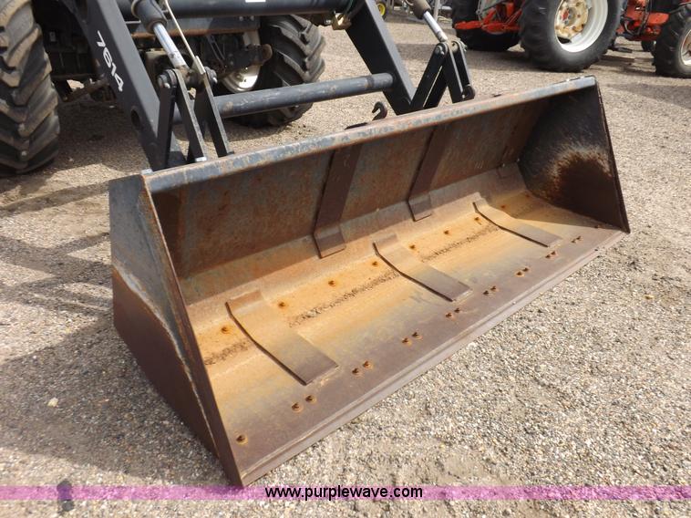 image for item H9107 1999 New Holland TV140 bi-directional MFWD tractor