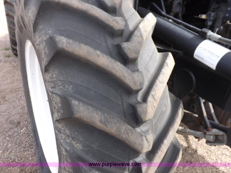 image for item H9107 1999 New Holland TV140 bi-directional MFWD tractor