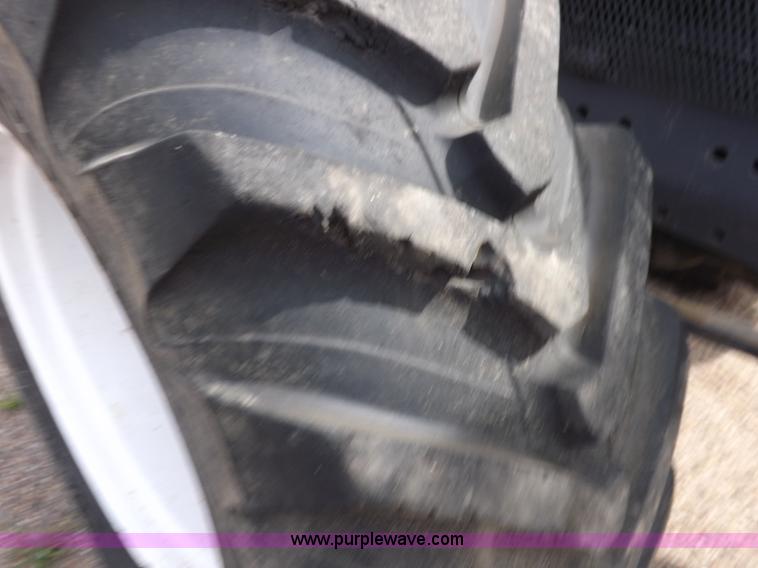 image for item H9107 1999 New Holland TV140 bi-directional MFWD tractor