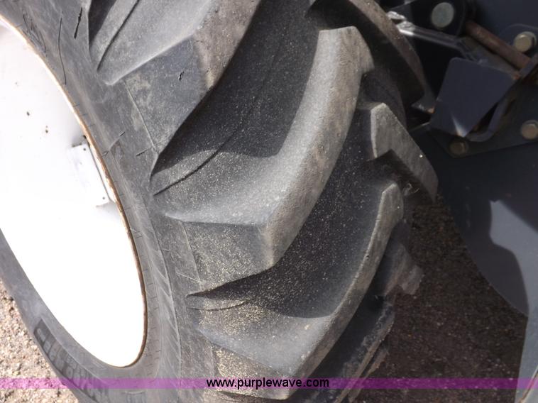 image for item H9107 1999 New Holland TV140 bi-directional MFWD tractor