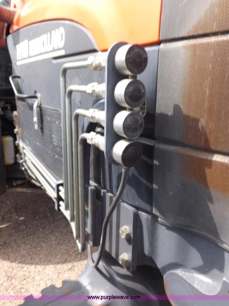 image for item H9107 1999 New Holland TV140 bi-directional MFWD tractor