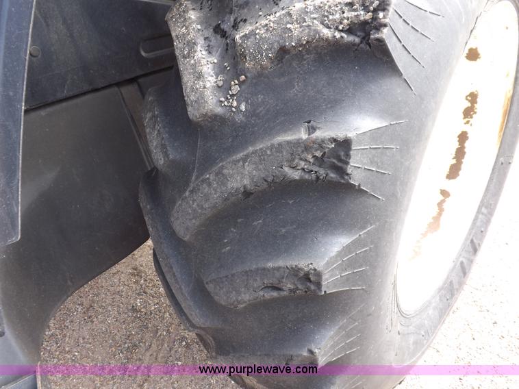 image for item H9110 2000 New Holland TS100 tractor