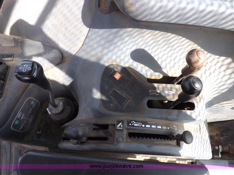 image for item H9111 1999 New Holland TS100 tractor