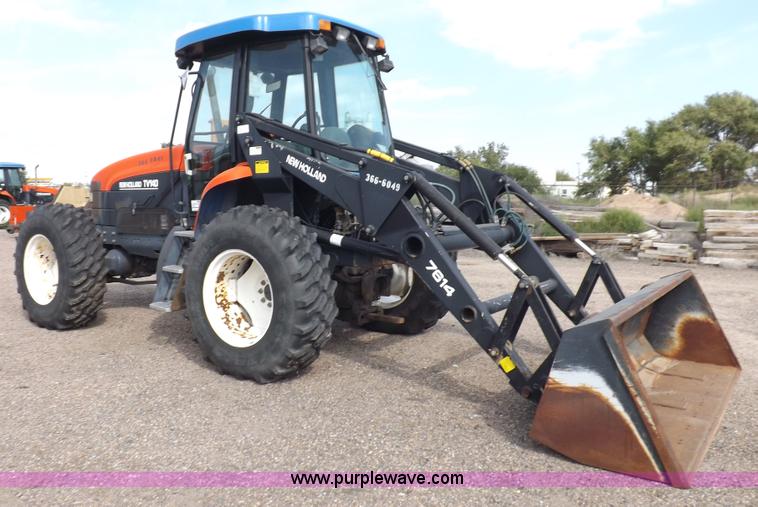 image for item H9112 1999 New Holland TV140 bi-directional MFWD tractor