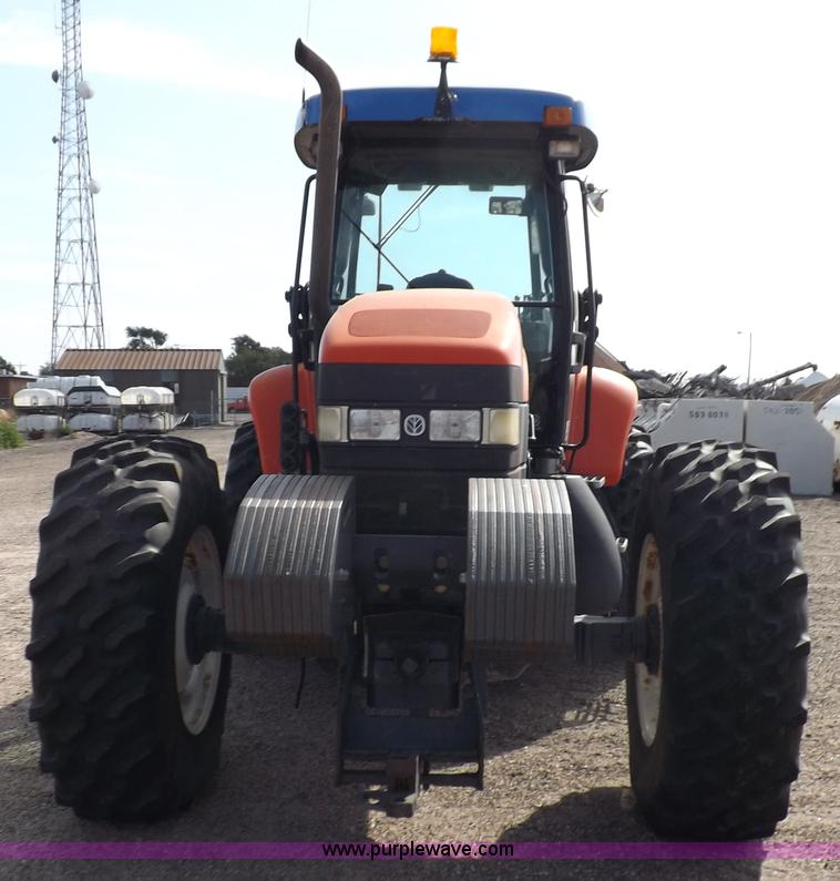 image for item H9112 1999 New Holland TV140 bi-directional MFWD tractor