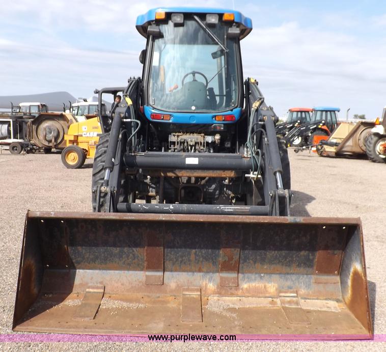 image for item H9112 1999 New Holland TV140 bi-directional MFWD tractor