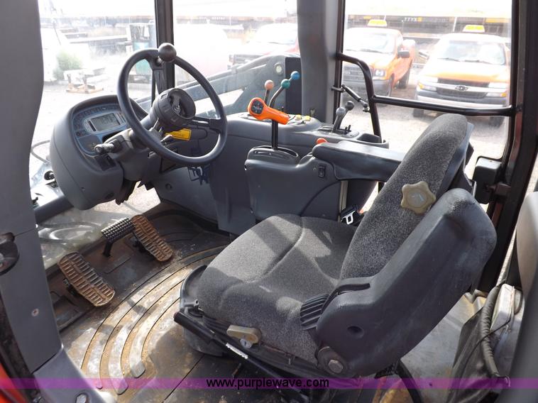 image for item H9112 1999 New Holland TV140 bi-directional MFWD tractor