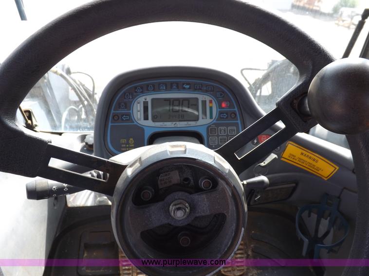 image for item H9112 1999 New Holland TV140 bi-directional MFWD tractor