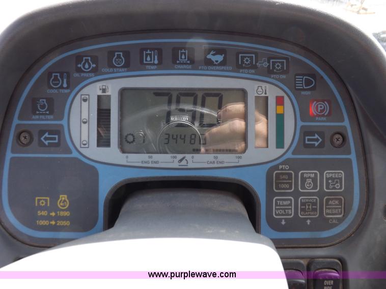 image for item H9112 1999 New Holland TV140 bi-directional MFWD tractor