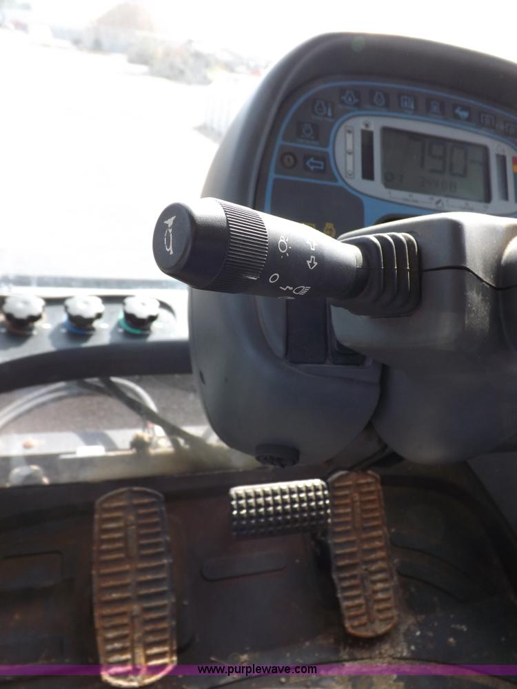 image for item H9112 1999 New Holland TV140 bi-directional MFWD tractor