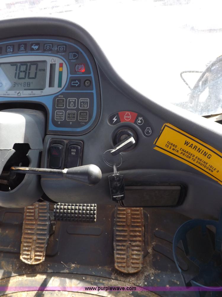 image for item H9112 1999 New Holland TV140 bi-directional MFWD tractor