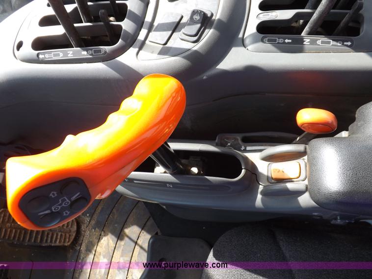 image for item H9112 1999 New Holland TV140 bi-directional MFWD tractor