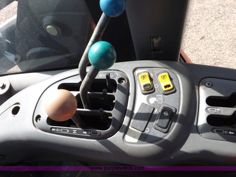 image for item H9112 1999 New Holland TV140 bi-directional MFWD tractor