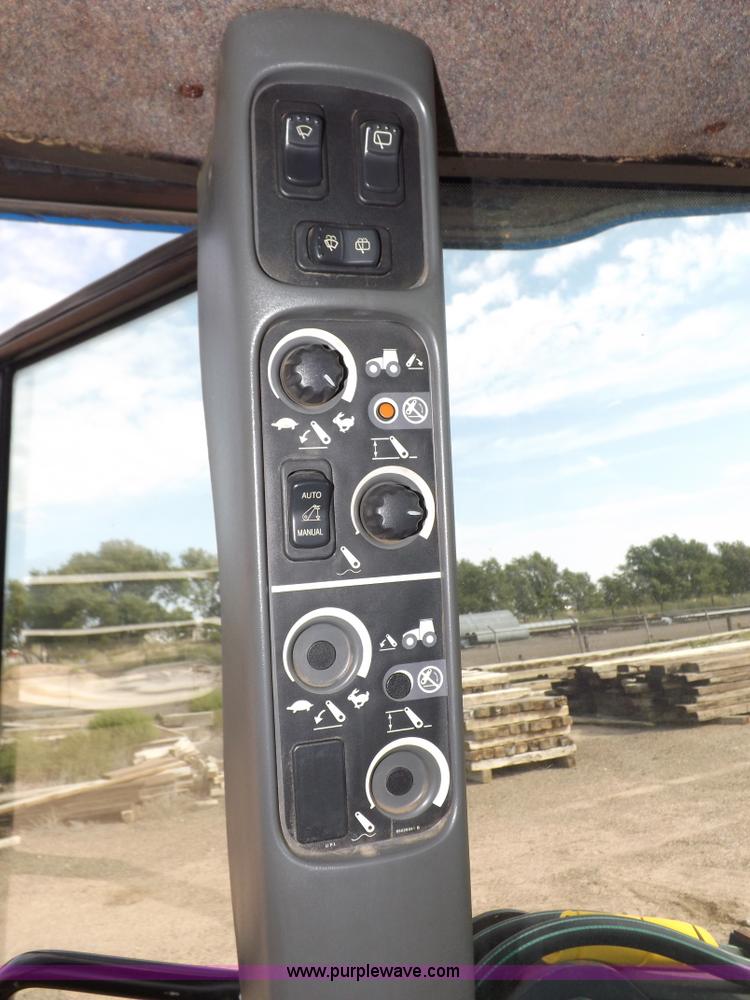 image for item H9112 1999 New Holland TV140 bi-directional MFWD tractor