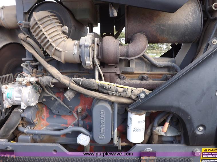 image for item H9112 1999 New Holland TV140 bi-directional MFWD tractor