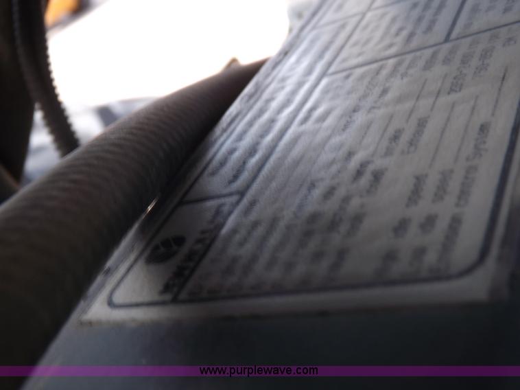 image for item H9112 1999 New Holland TV140 bi-directional MFWD tractor