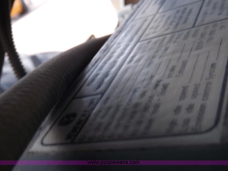 image for item H9112 1999 New Holland TV140 bi-directional MFWD tractor