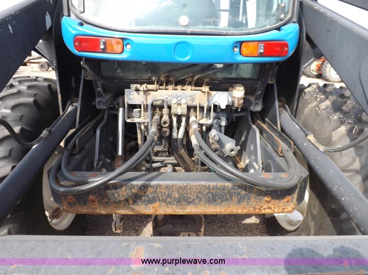 image for item H9112 1999 New Holland TV140 bi-directional MFWD tractor