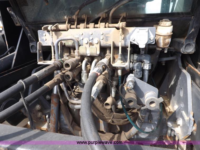 image for item H9112 1999 New Holland TV140 bi-directional MFWD tractor