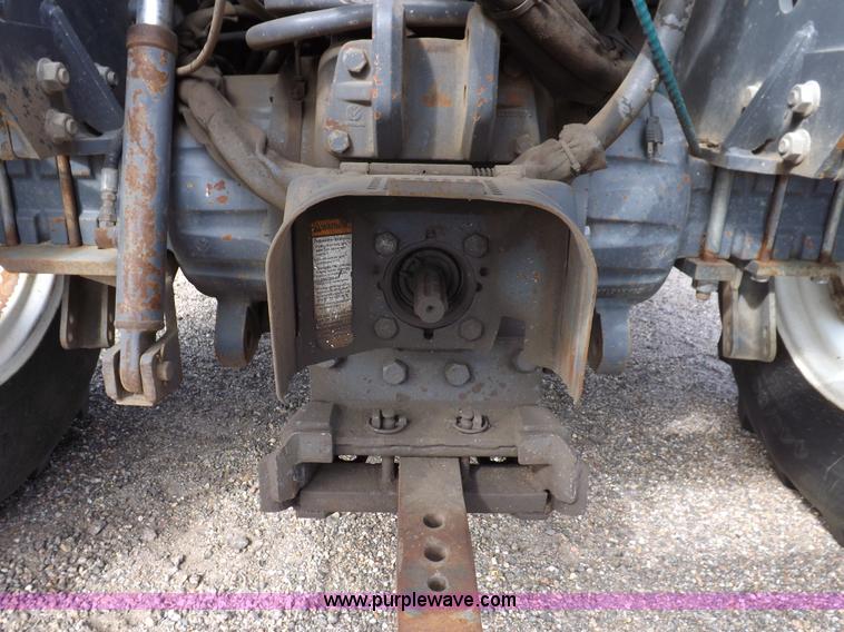 image for item H9112 1999 New Holland TV140 bi-directional MFWD tractor