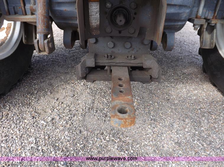 image for item H9112 1999 New Holland TV140 bi-directional MFWD tractor