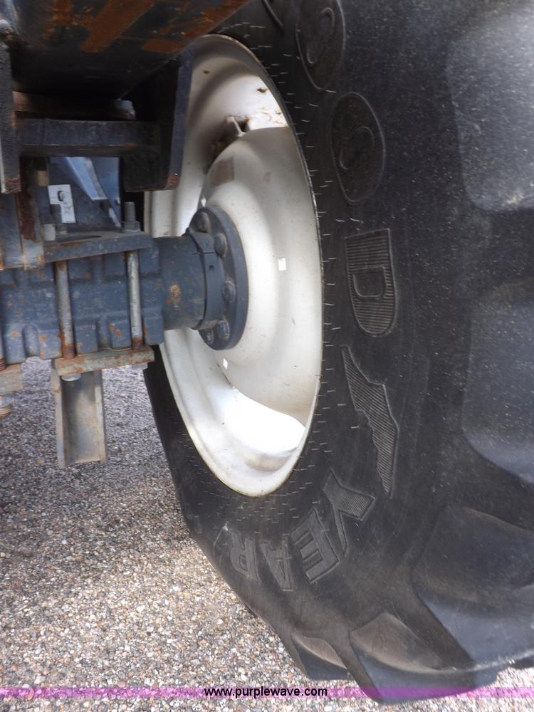 image for item H9112 1999 New Holland TV140 bi-directional MFWD tractor