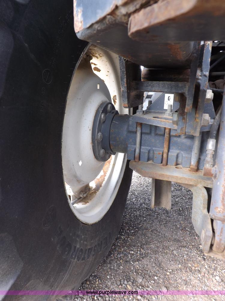 image for item H9112 1999 New Holland TV140 bi-directional MFWD tractor