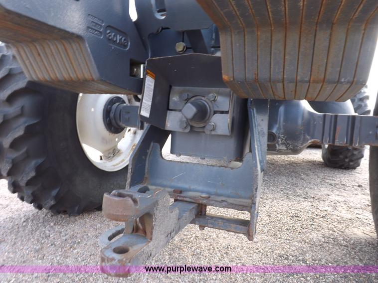 image for item H9112 1999 New Holland TV140 bi-directional MFWD tractor