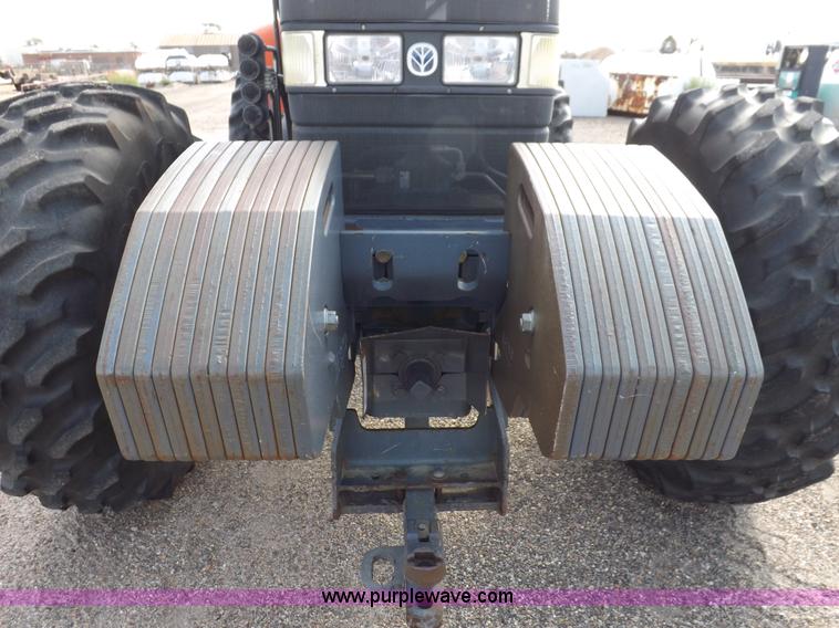 image for item H9112 1999 New Holland TV140 bi-directional MFWD tractor