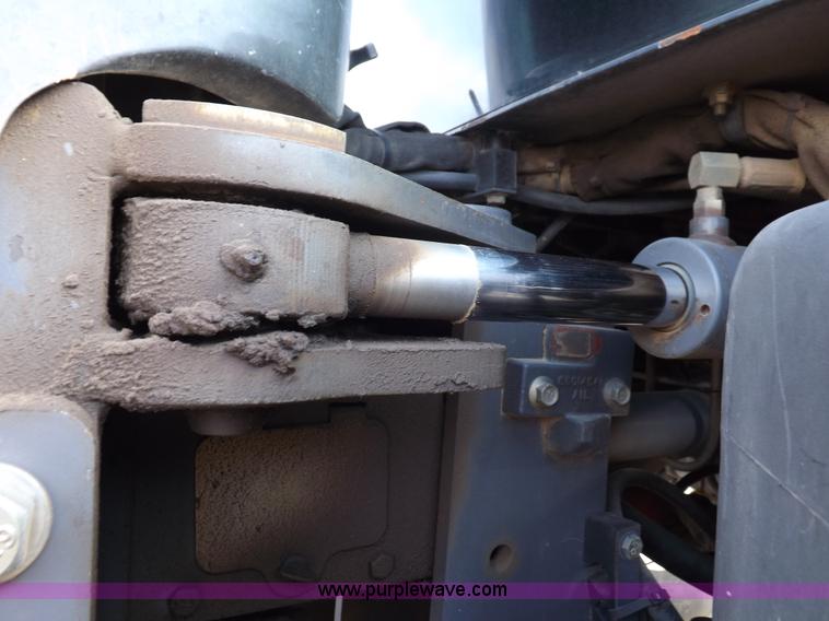 image for item H9112 1999 New Holland TV140 bi-directional MFWD tractor