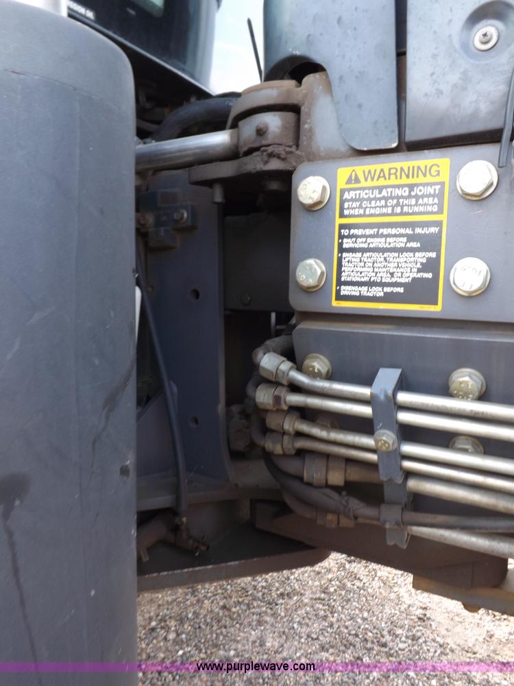 image for item H9112 1999 New Holland TV140 bi-directional MFWD tractor